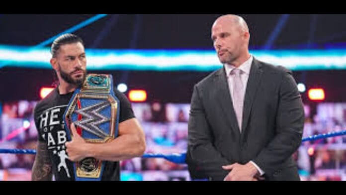 Roman Reigns and Adam Pearce Roman Reigns and Adam Pearce