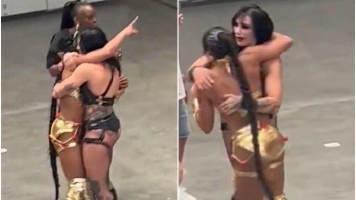 Rhea Ripley and Bianca Belair hugging Rhea Ripley and Bianca Belair hugging